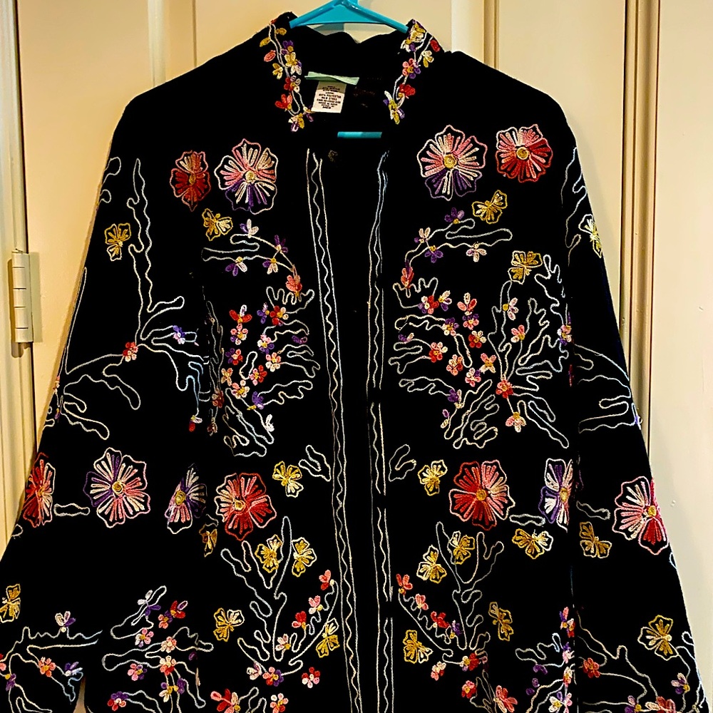 A 220 Hickory ornate thread loop patterns in soft colors on the black M jacket